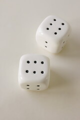 Two white dices isolated on light beige background. Poster, card