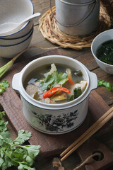 Traditional Thai White Tom Yum Soup with Fragrant Herbs and Spices