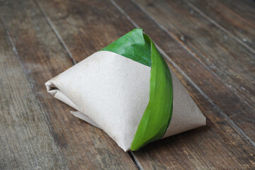 Traditional Malaysian Nasi Lemak Wrapped in Banana Leaf with Fragrant Rice and Spicy Sambal