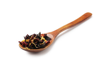 Spoon with dried tea leaves isolated on white