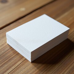 Fototapeta premium Stack of Blank White Business Cards on Wooden Table Mockup