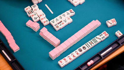 A mahjong table with an active game. Fragment of the game. © Volha