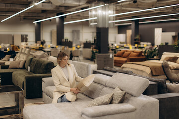 Woman Shopping for Sofas in Modern Furniture Store Interior