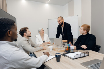 Team Collaboration and Strategy Meeting in Modern Office Environment
