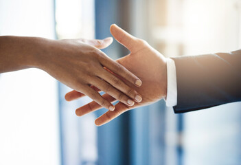 Office, handshake and deal for people, agreement and closeup of partnership in meeting or...