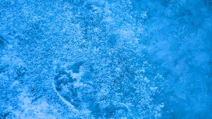 Vibrant ice texture illuminated by sunlight, showcasing shimmering patterns and frosty crystals in a serene winter backdrop, background