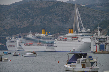 Modern cruiseship cruise ship liner Mediterranea docked in Dubrovnik, Croatia with island...
