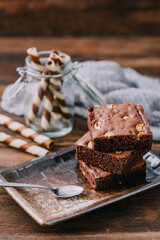 Brownies on wooden background