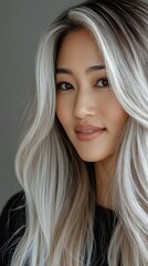 Fototapeta premium Asian Hair Model for Advertising Hair Care. A portrait of a woman with long, wavy hair.