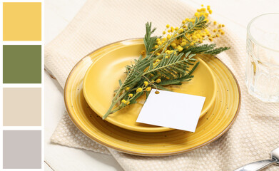 Beautiful table setting with blank card and mimosa flowers on white wooden background, closeup