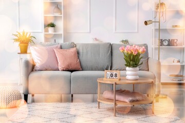 Obraz premium Calendar with date of International Women's Day and tulips on table in living room