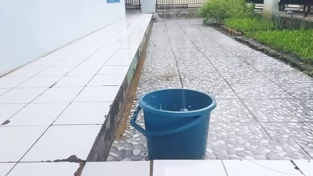 Rainwater is collected in buckets