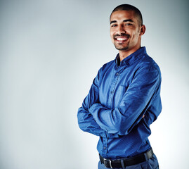 Obraz premium Portrait, business and man in studio, arms crossed and professional on white background. Space, happy person and model with confidence, career ambition and growth for startup, about us and success