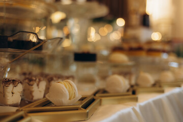 Elegant Dessert Buffet Table With Sweet Treats and Warm Ambient Lighting
