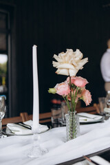 Elegant Table Decor Featuring Roses and Candle for Special Occasion
