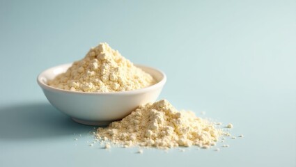 Collagen peptides powder. Bowl is full of flour and spoon is on table
