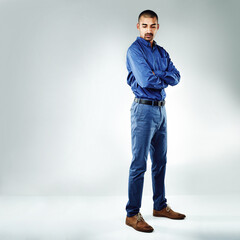 Naklejka premium Arms crossed, space and thinking with business man in studio for inspiration, opportunity or problem solving. Idea, mission and serious with employee on white background mockup for career solution