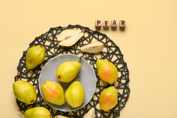 Word PEAR and bowl with fresh fruits on yellow background