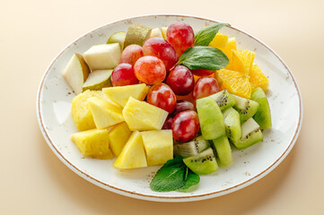 fruit plate with grapes, kiwi and orange