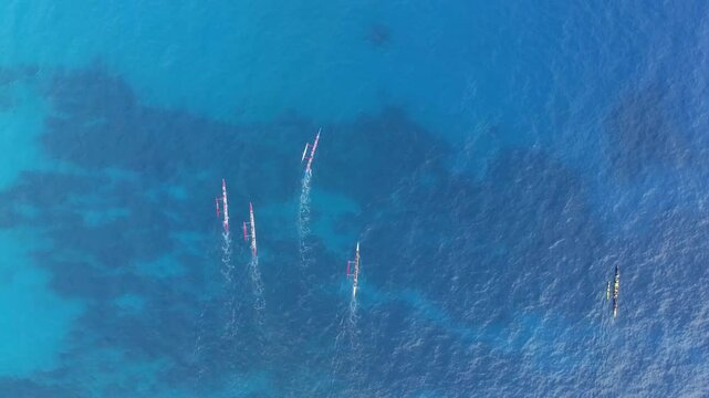 Overhead outrigger canoes blue ocean Hawaiian coast
