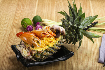 Rice with seafood in pineapple