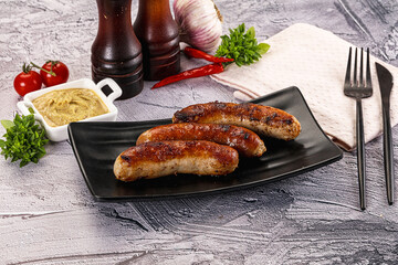 Delicous natural roasted sausages in the plate
