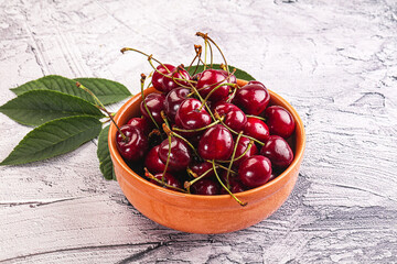 Red sweet cherry in the bowl