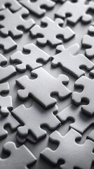 Gray jigsaw puzzle pieces creating intriguing pattern