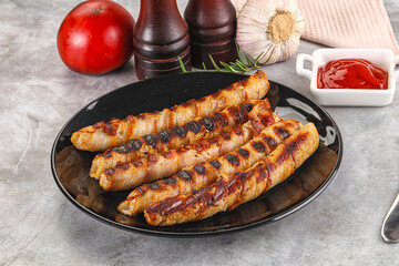 Grilled meat sausages wrapped bacon