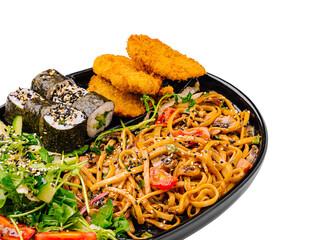 Delicious mixed platter of noodles and sushi with crispy sides