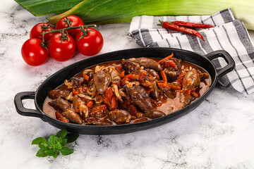 Baked chicken hearts with vegetables