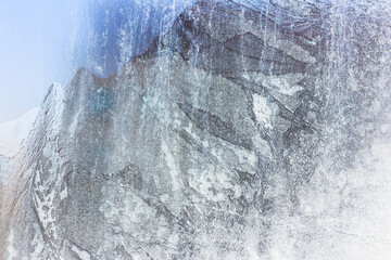Frost on a window glass. Frozen glass.