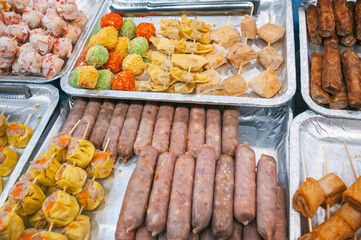 Fast food at vietnamese night market in Asia. Traditional asian street food on the counter in Vietnam in Da Nang