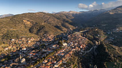 Architecture stone buildings, traditional Turkish village houses in touristic place Birgi, Izmir. Landscape with aerial drone.