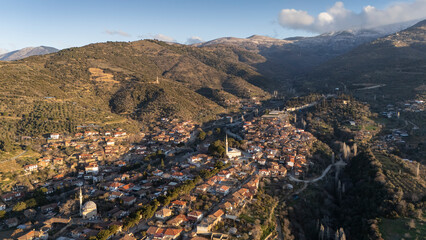 Architecture stone buildings, traditional Turkish village houses in touristic place Birgi, Izmir. Landscape with aerial drone.