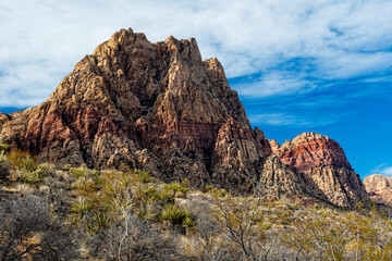 This breathtaking image features majestic mountain peaks beneath a dramatic sky, highlighting nature's grandeur, inspiring awe and a sense of adventure in the viewer.