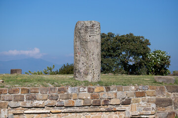 Columns and carved stone at the ancient ruins of Monte Alban in Oaxaca, Mexico.