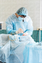 Male otolaryngologist performs septoplasty in the operating room. Deviated nasal septum. ENT....