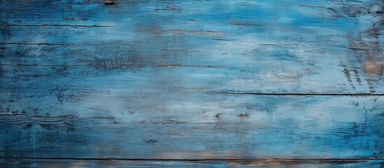 Obraz premium Weathered blue wooden board background showcasing rich textures with shades of blue and hints of brown, ideal for artistic or rustic design projects.