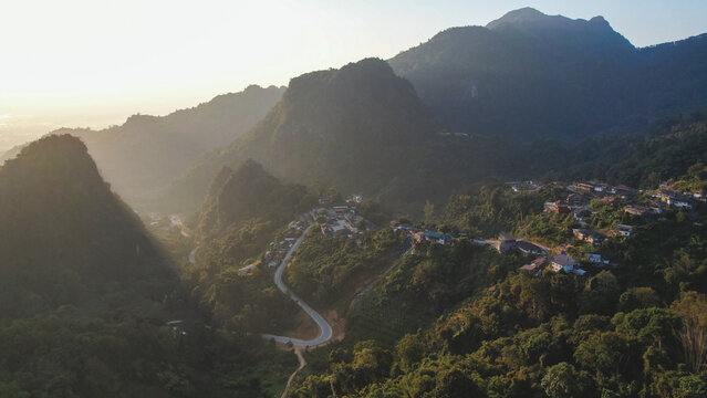 Aerial view from drone of the rural village in the mountains before sunrise