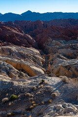 Obraz premium A stunning geological formation of red rocks highlighting the rugged natural terrain under the bright blue sky, representing the immense power and beauty of nature.