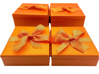 Four Orange Gift Boxes with Satin Ribbons: A Festive Present Arrangement