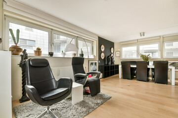 A stylish interior featuring sleek furniture, large windows for natural light, and a clean, uncluttered aesthetic that emphasizes comfort and functionality.