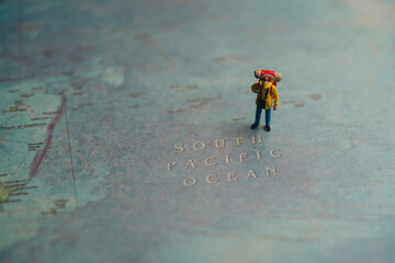 Adventurer on World Map with South Pacific Ocean Highlighted, Travel concept