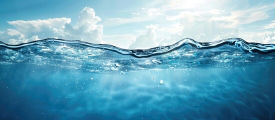 Crystal-clear underwater view showcasing a shimmering blue water surface with gentle waves and soft clouds in a bright sky above, ample copy space.