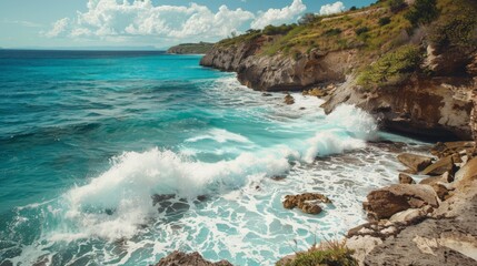 Obraz premium A panoramic view of a cliffside beach with waves crashing against the rocks with