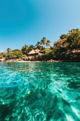 Obraz premium Seaside resort in a tropical island. Calm water, lush vegetation in background