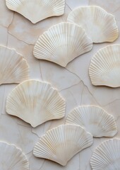 Group of nine white scallop shells arranged in a scattered pattern on a beige background. the shells are of different sizes and shapes, with some being larger and others being smaller.