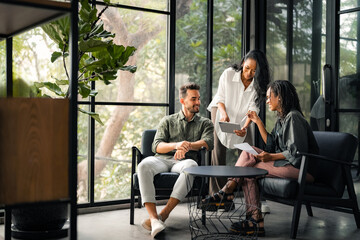 Group of busy happy diverse professional business team people working in office using digital tablet