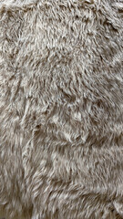 Close-up of a clean, new and fluffy faux fur carpet surface.